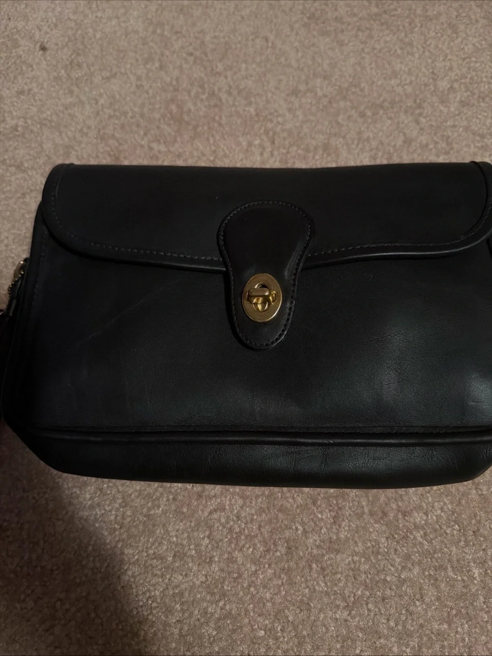 NWOT vintage black leather Coach wristlet features a classic a detachable strap